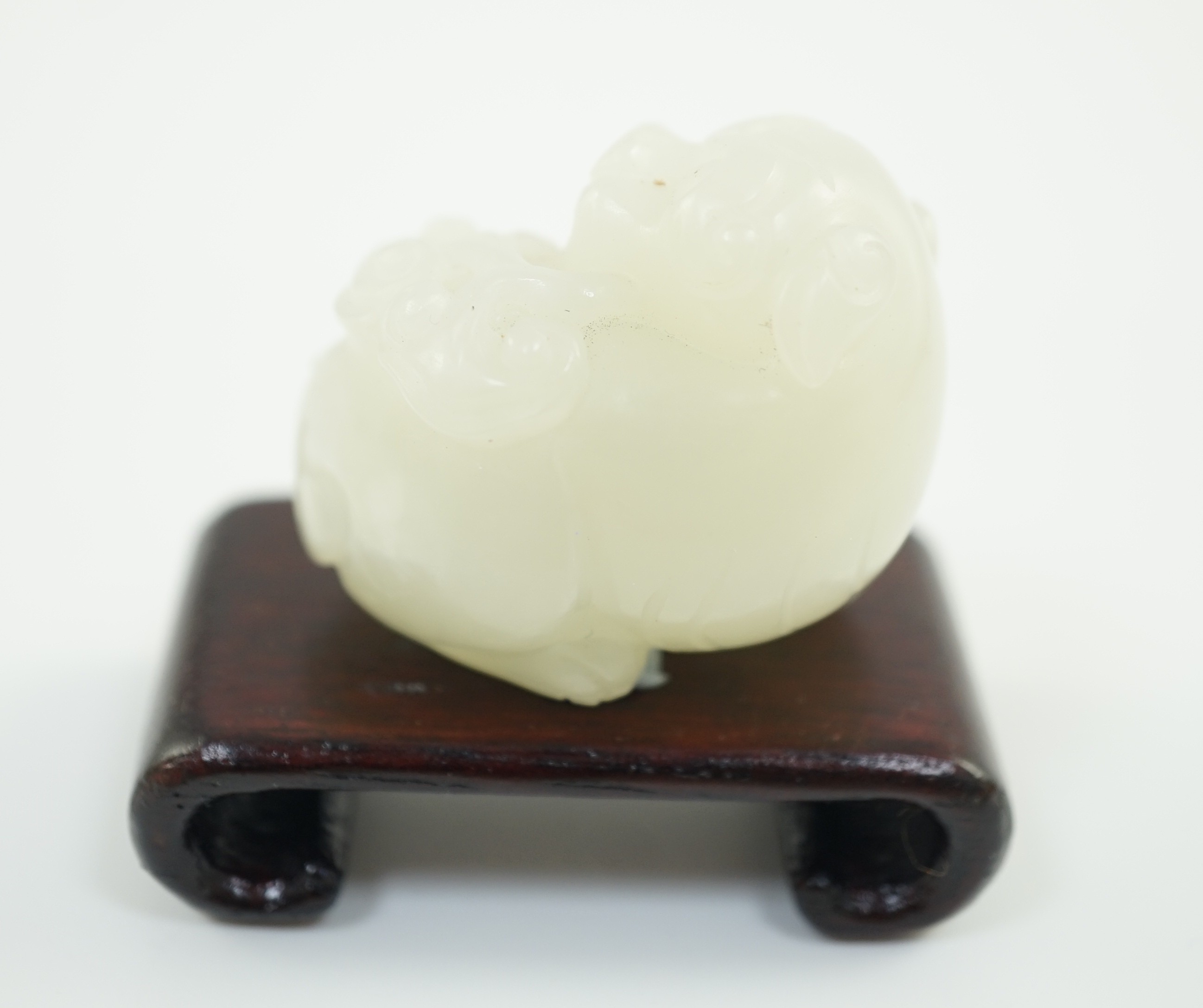 A Chinese white jade figure of a pug dog, 19th/20th century, 3.7cm long